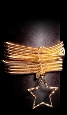 Armband aus Spiralfedern mit Schmuck-Stern in gold