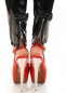 Preview: Sexy Stretchhose im Latex-Look mit Zierschleife in schwarz
