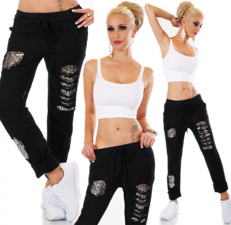 Moderne Freizeithose mit Pailletten unterlegten Löchern in schwarz