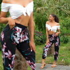 Preview: Sommerhose mit bunten Blütenmuster in schwarz