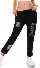 Moderne Freizeithose mit Pailletten unterlegten Löchern in schwarz
